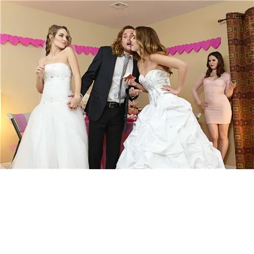 Two blonde females posed with male wearing wedding gowns